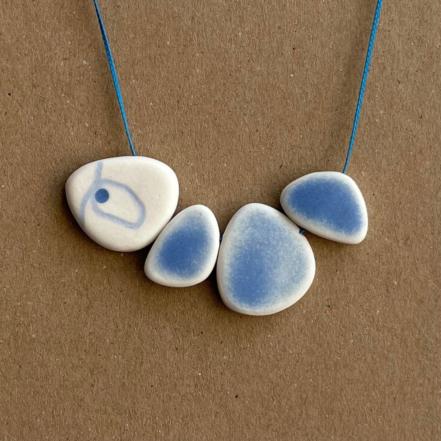 FOUR BEAD PEBBLE NECKLACES