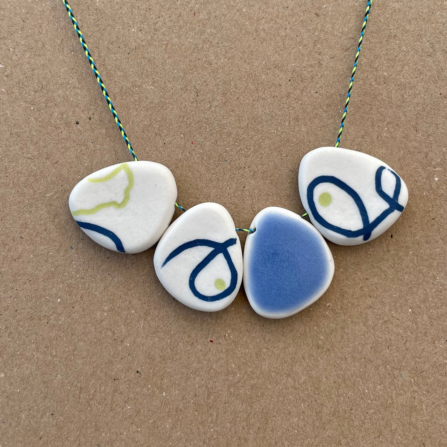 FOUR BEAD PEBBLE NECKLACES