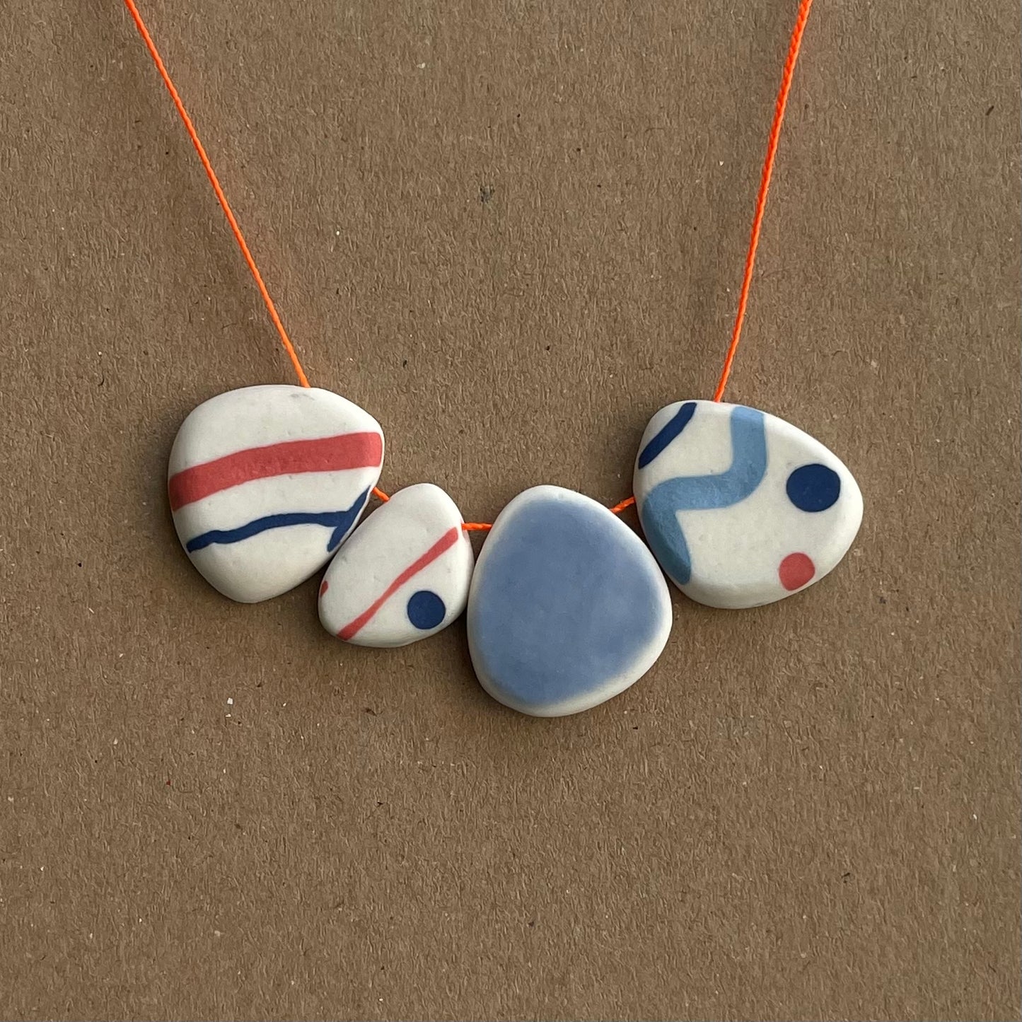 FOUR BEAD PEBBLE NECKLACES